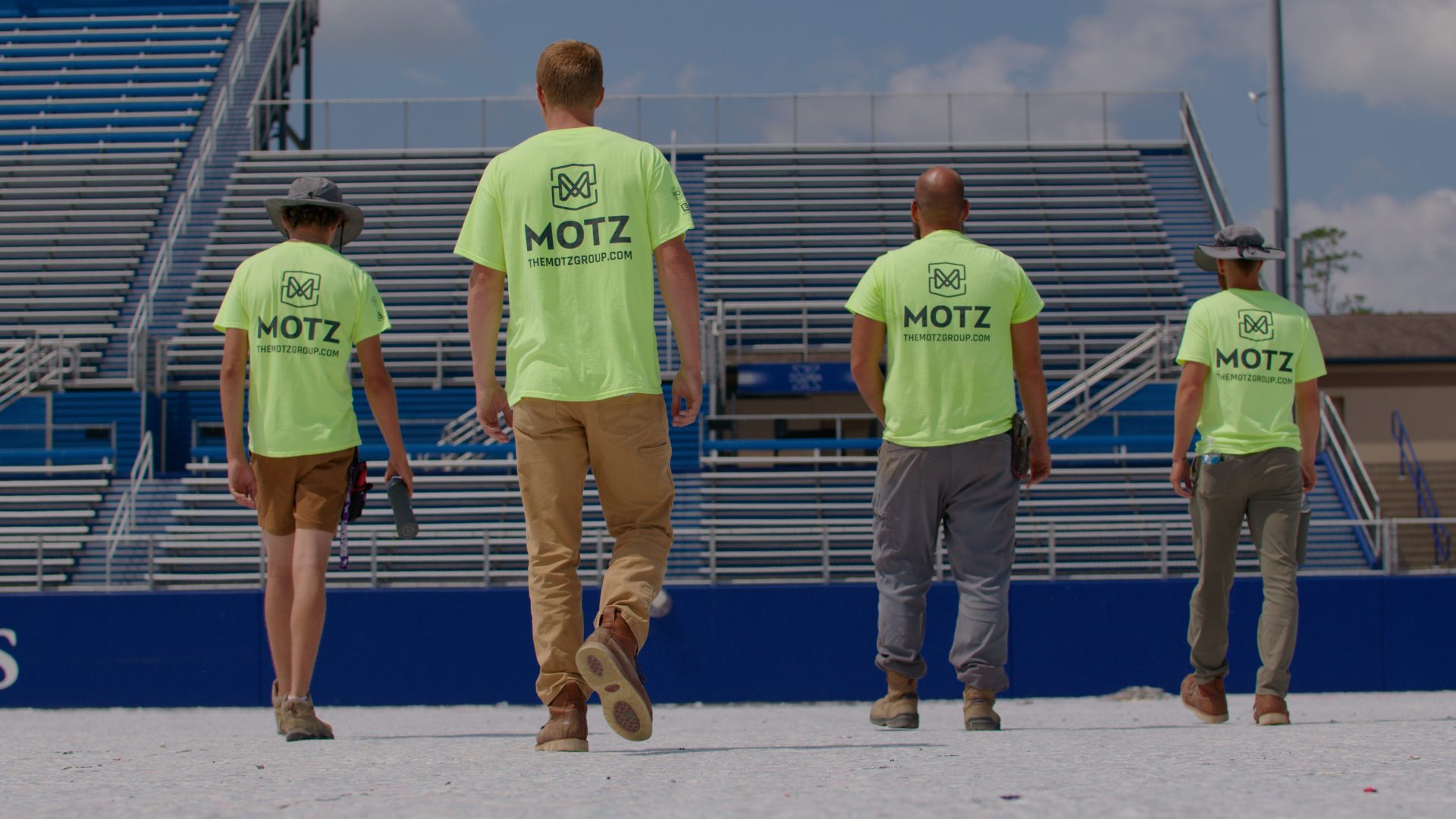 field installation crew walking on field