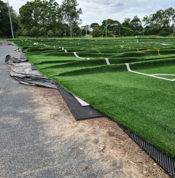 Displaced carpet on a playing field.